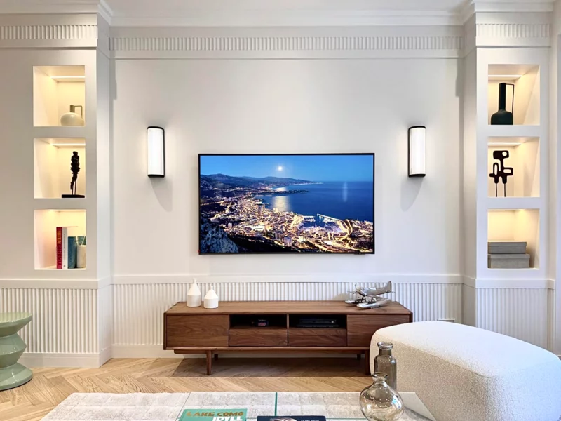 Photograph of an apartment living room in Monaco, in natural light and with its real view, unaltered by artificial intelligence